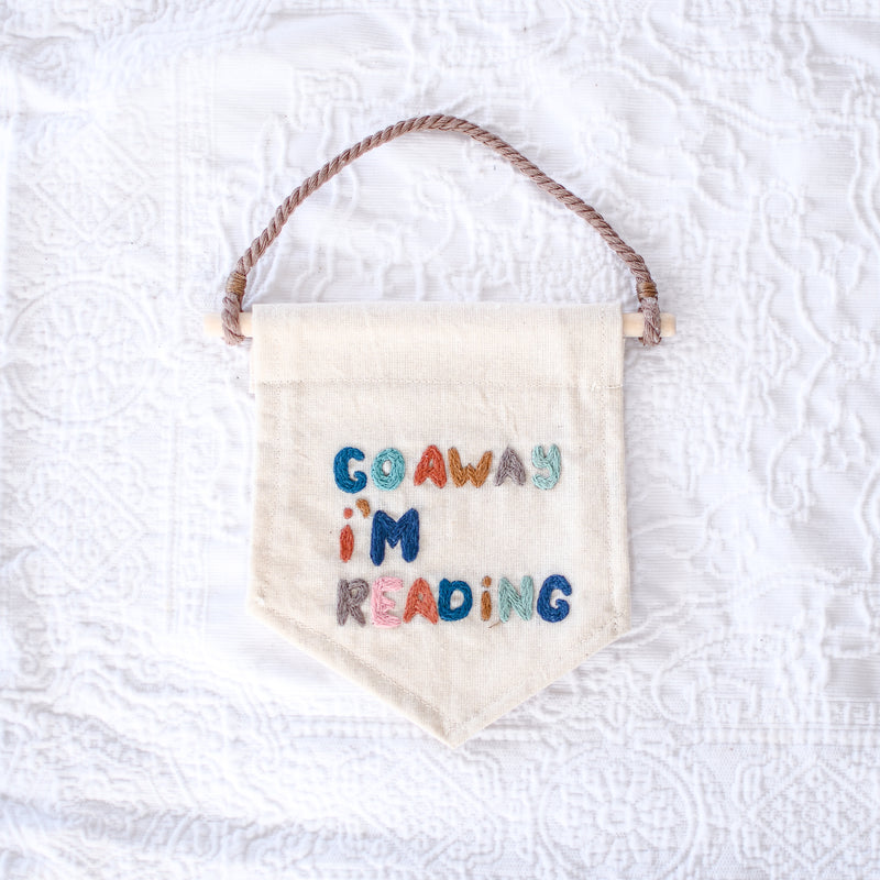 Go Away I’m Reading Hand Embroidery Banner